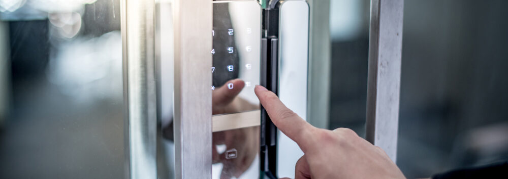 Businessman,Hand,Pressing,Down,Password,Number,On,Electronic,Access,Control