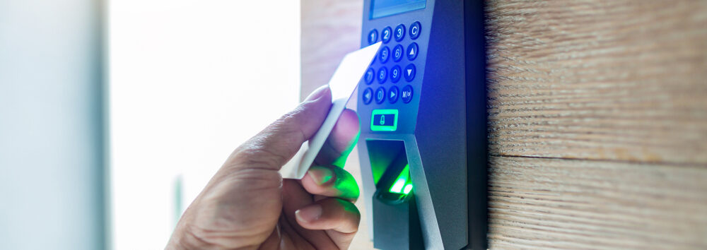 Door,Access,Control.,Staff,Holding,A,Key,Card,To,Lock